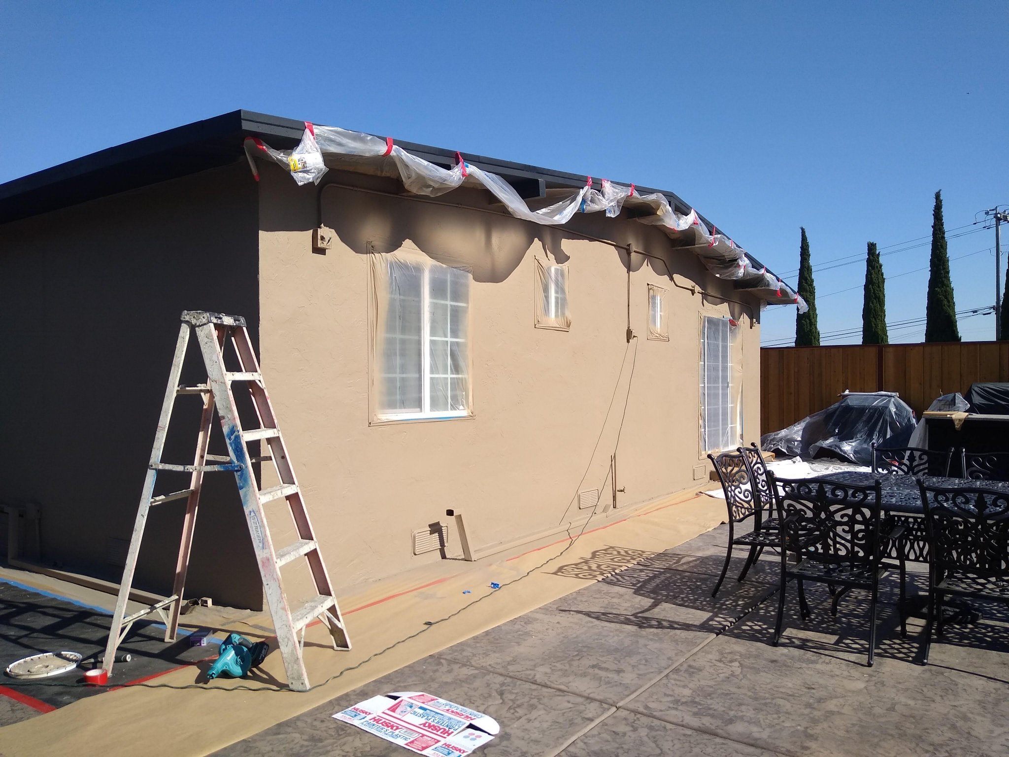 Exterior wall repair and painting preparation