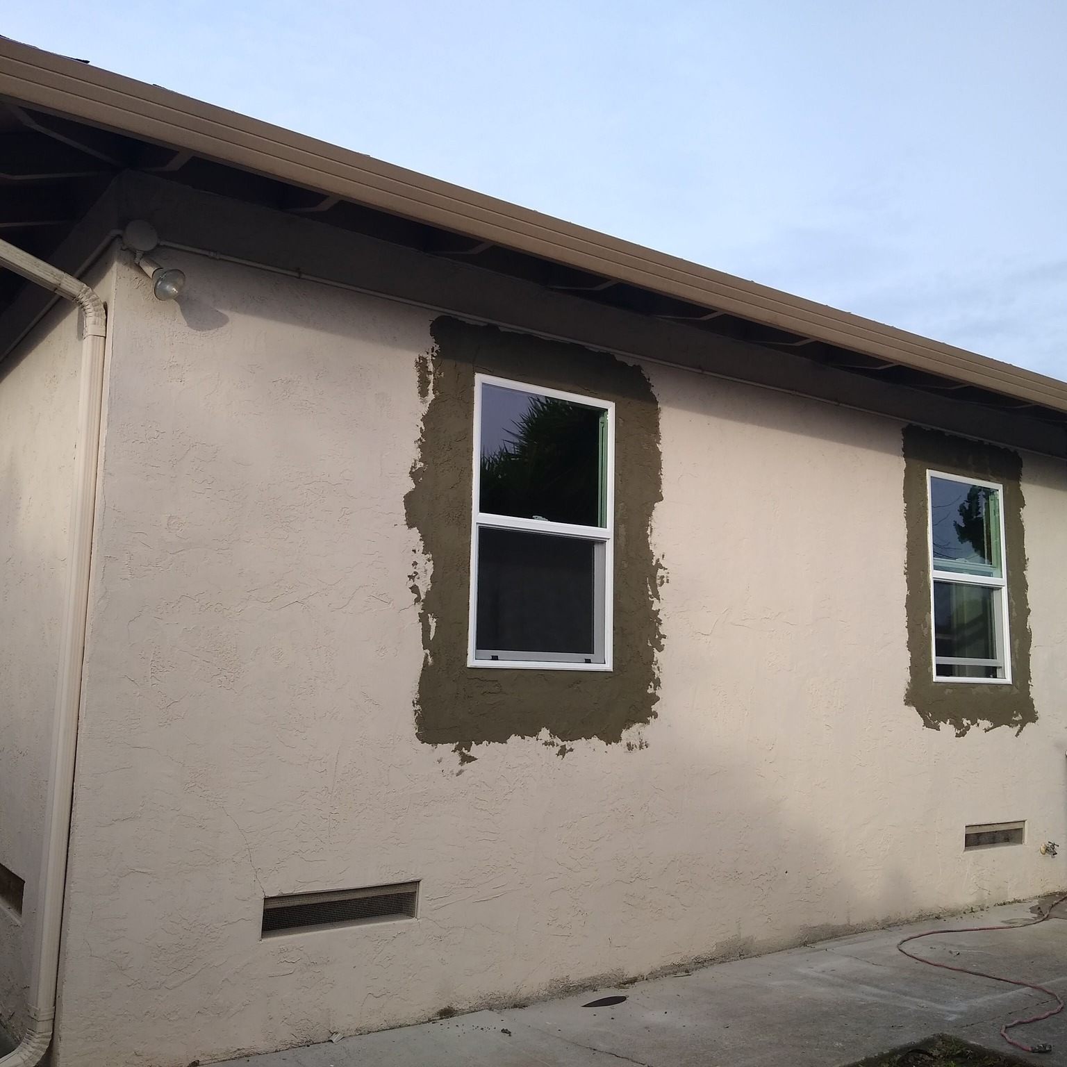 Window area stucco patch and texture repair